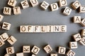 the word offline wooden cubes with burnt letters