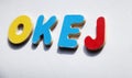 The word OKEJ in wooden letters on light surface Royalty Free Stock Photo