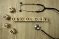 Word oncology from wooden blocks with stethoscope