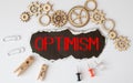 word Optimism on black torn paper, concept Royalty Free Stock Photo