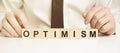 Word OPTIMISM made with wood building blocks on background Royalty Free Stock Photo