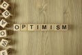 Word optimism from wooden blocks Royalty Free Stock Photo