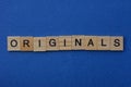 Word originals made from brown wooden letters Royalty Free Stock Photo