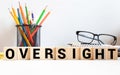 word Oversight on wooden block, concept business Royalty Free Stock Photo