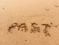 Word Past on sand