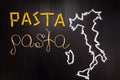 Word pasta made of dry pasta on the black background with frame of country Italy written by chalk Royalty Free Stock Photo