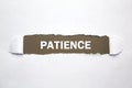Word Patience on torn paper Royalty Free Stock Photo