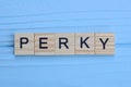 word perky made from wooden gray letters