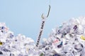 Word Personal data hooked on fishing hook pulled from pile of shredded documents