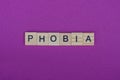 Word phobia from small gray wooden letters