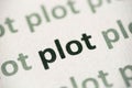 Word plot printed on paper macro Royalty Free Stock Photo