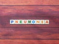 Word Pneumonia on wood