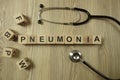 Word pneumonia from wooden blocks with stethoscope