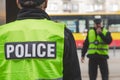 Close-up of word police written on reflective vests of police officers