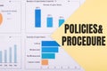 The word POLICIES & PROCEDURE is written on a yellow background with charts and graphs Royalty Free Stock Photo