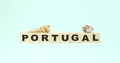 Word Portugal small wooden blocks and seashells on mint