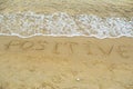 Word positive written on the beach sand Royalty Free Stock Photo