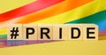 Word PRIDE made with wooden blocks