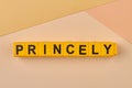 The word princely written on yellow cubes on color background close up.