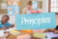 Principles against pretty teacher helping pupils in classroom Royalty Free Stock Photo