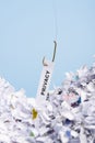 Word Privacy hooked on fishing hook pulled from pile of shredded documents