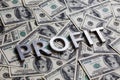 The word PROFIT laid with aluminium letters on the US dollar banknotes background - with selective focus Royalty Free Stock Photo