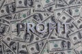 The word PROFIT laid with aluminium letters on the US dollar banknotes background - with selective focus Royalty Free Stock Photo