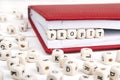 Word Profit written in wooden blocks in red notebook on white wooden table. Royalty Free Stock Photo