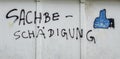 Word property damage on a wall in german Royalty Free Stock Photo