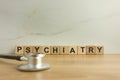 Word psychiatry from wooden cubes with stethoscope