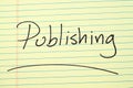 Publishing On A Yellow Legal Pad Royalty Free Stock Photo