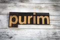 Purim Letterpress Word on Wooden Background