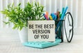 Word quotes of BE THE BEST VERSION OF YOU on colorful memo papers with wooden background