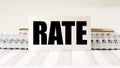 Word RATE on paper on office table. Finance concept