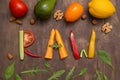 Word Raw written with different raw vegetables, fruits, nuts and greens on rustic wooden background Royalty Free Stock Photo