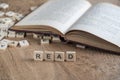 The word read written with cube letters on wood background