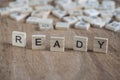 The word ready written with cube letters on wood Royalty Free Stock Photo