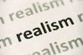 Word realism printed on paper macro Royalty Free Stock Photo