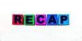 The word RECAP is written on colorful cubes on a light background