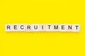 Word recruitment on yellow background. Job board. Human Resource Management and Recruitment and Hiring concept