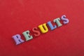 RESULTS word on red background composed from colorful abc alphabet block wooden letters, copy space for ad text. Learning english Royalty Free Stock Photo