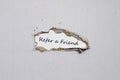 The word refer a friend appearing behind torn paper. Royalty Free Stock Photo