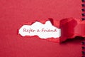 The word refer a friend appearing behind torn paper. Royalty Free Stock Photo