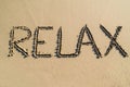 Word relax on beach Royalty Free Stock Photo