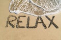 Word relax on beach Royalty Free Stock Photo