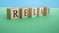 The word relax made from wooden cubes. Rest and calm concept Royalty Free Stock Photo