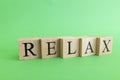 The word relax made from wooden cubes. Rest and calm concept Royalty Free Stock Photo