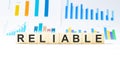 Word RELIABLE made with wood building blocks Royalty Free Stock Photo