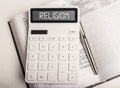 Word religion on calculator. Concept of religion is business Royalty Free Stock Photo