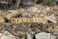 The Word Religion was created from wooden cubes. Photographed on the wall. Royalty Free Stock Photo